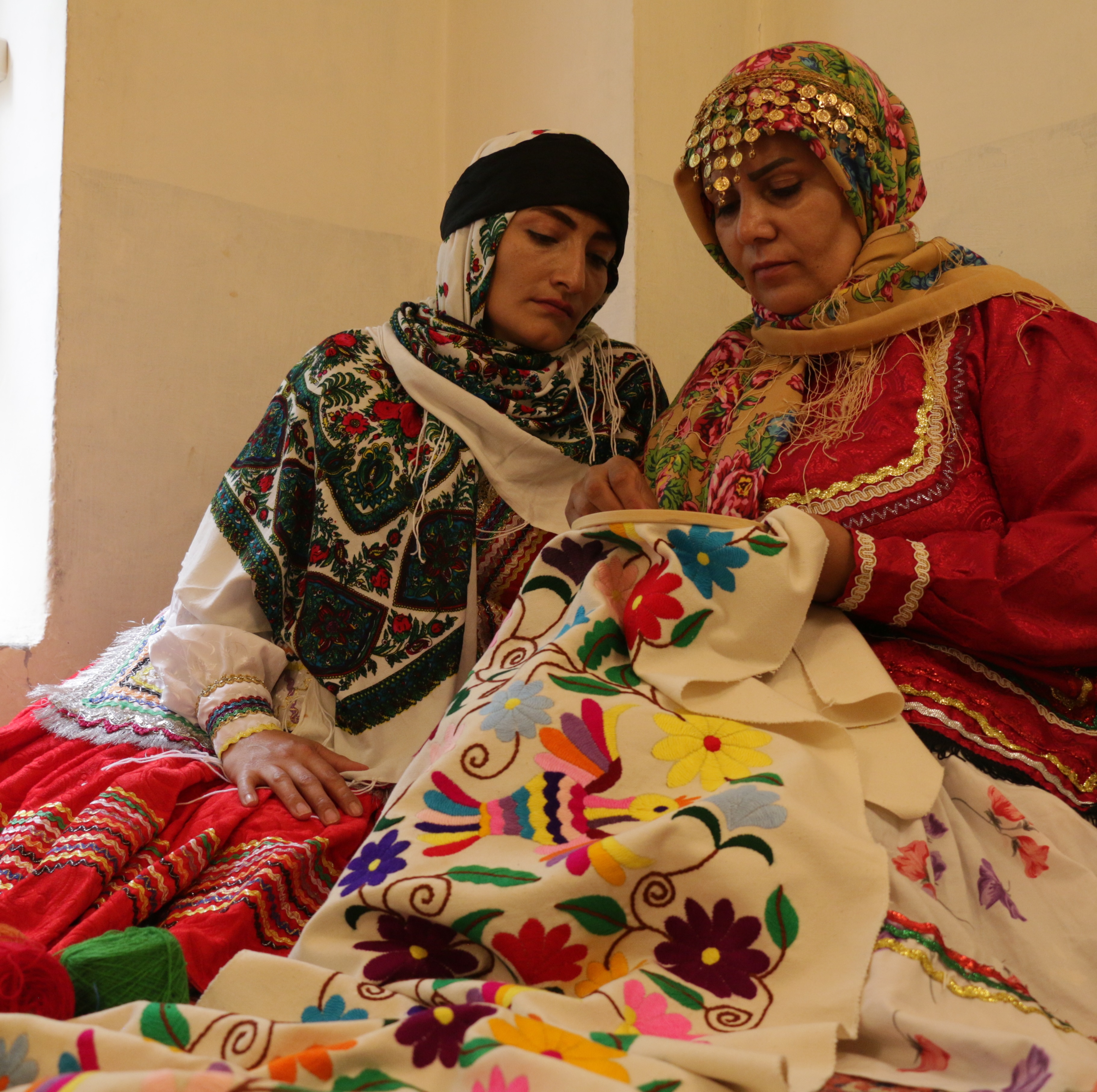 Two rural women doing hand embroidery