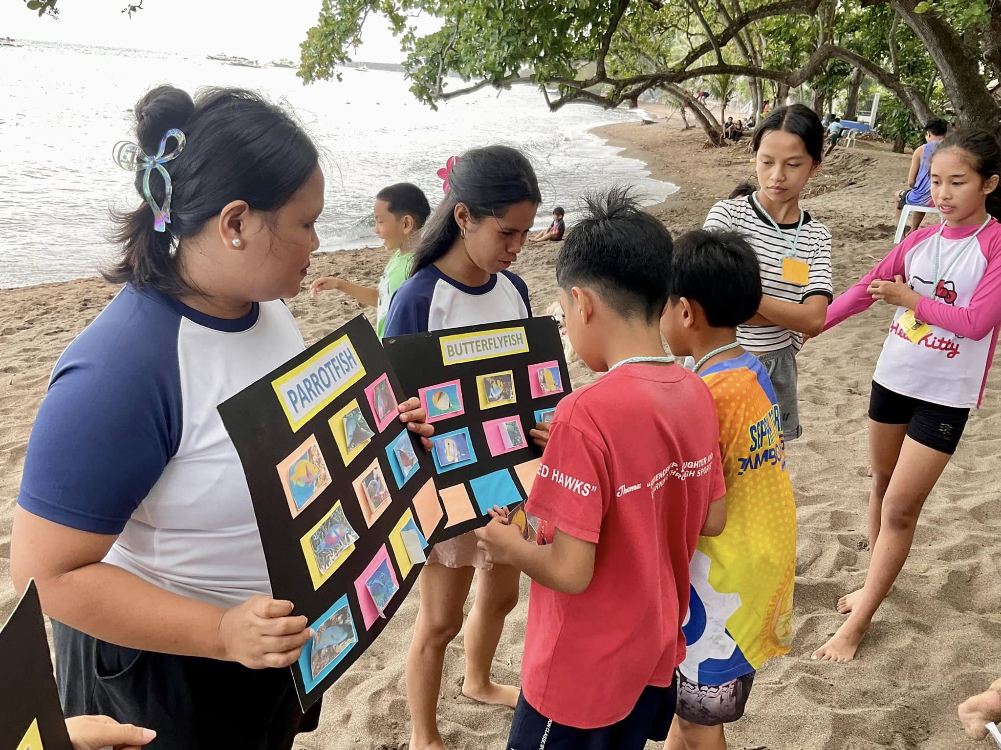 Youth learning about ocean life before and after snorkeling