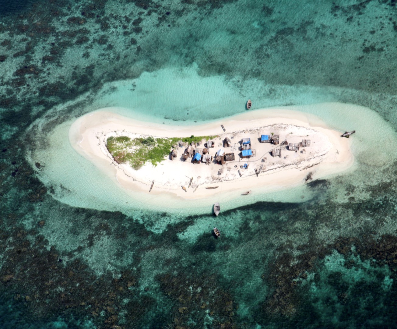 Figure 6. Aerial view of one islet along the coastline of Southern Haiti. It shows the high exposure of a community living without protection at sea level. Photo by Antonio Perera.