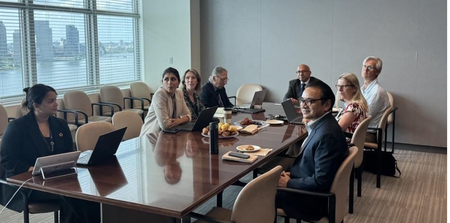 A group of people around a table
AI-generated content may be incorrect.