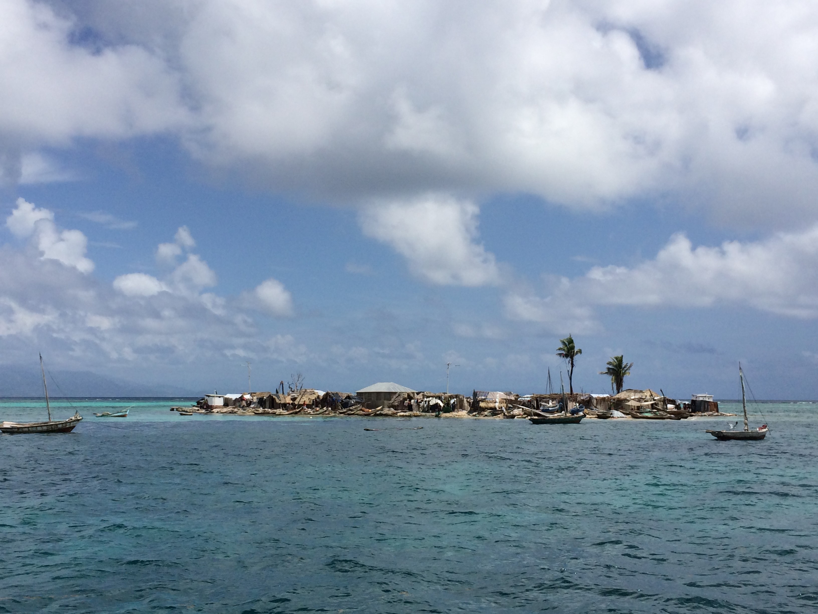 Figure 5. A small island along the Southern coast of Haiti. The community living on the island relies mainly on ocean resources, already overexploited, for livelihoods. Access to social services is a challenge. While early warning systems need to be strengthened, a one-km barrier reef located near the island is currently the only natural protection mechanism against wave surge and hurricanes. Photo by Maximilien Pardo.